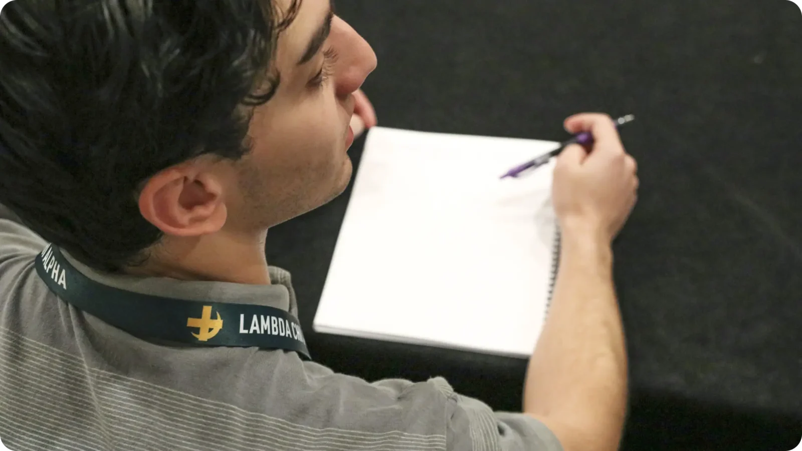 A brother with a notepad